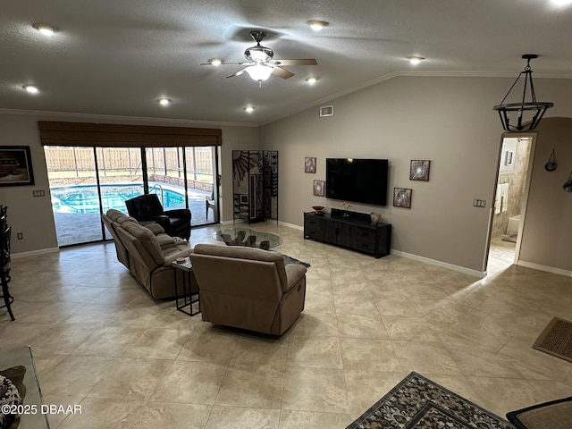 living room with vaulted ceiling, ornamental molding, a textured ceiling, and ceiling fan