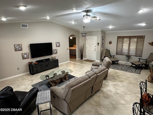 living room with crown molding, lofted ceiling, a textured ceiling, and ceiling fan