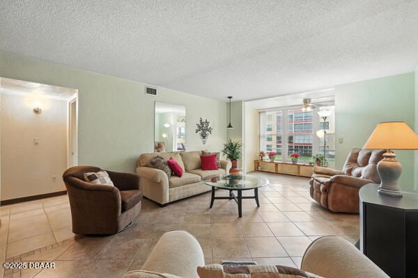 329 Wilder Blvd Unit C 201, Daytona Beach, FL 32114 - living area with light tile patterned flooring and a textured ceiling