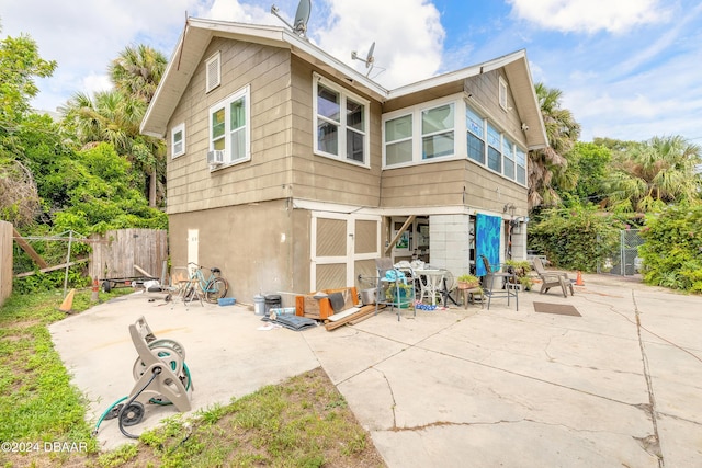 back of property featuring a patio area