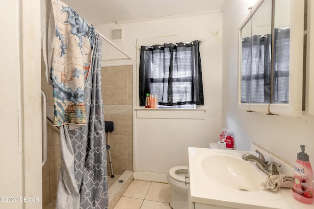 bathroom featuring tile patterned flooring, vanity, curtained shower, and toilet