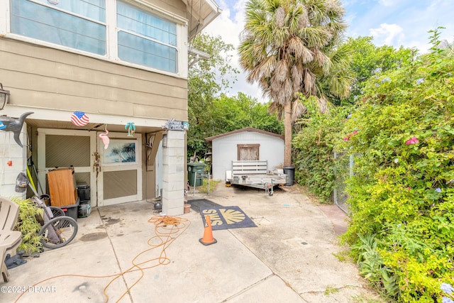 view of patio / terrace with a shed