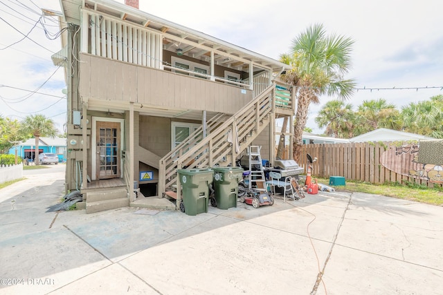 back of property with a balcony