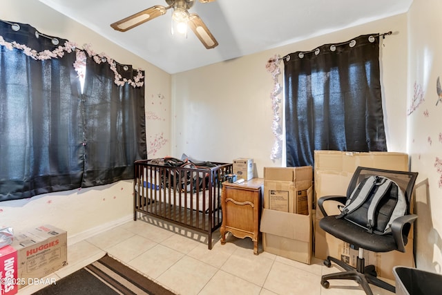 tiled bedroom with ceiling fan