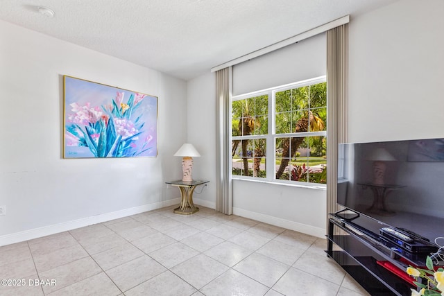 1248 Girog Ave, Port Orange, FL 32129 - spare room with light tile patterned flooring, baseboards, a textured ceiling, and a smoke detector
