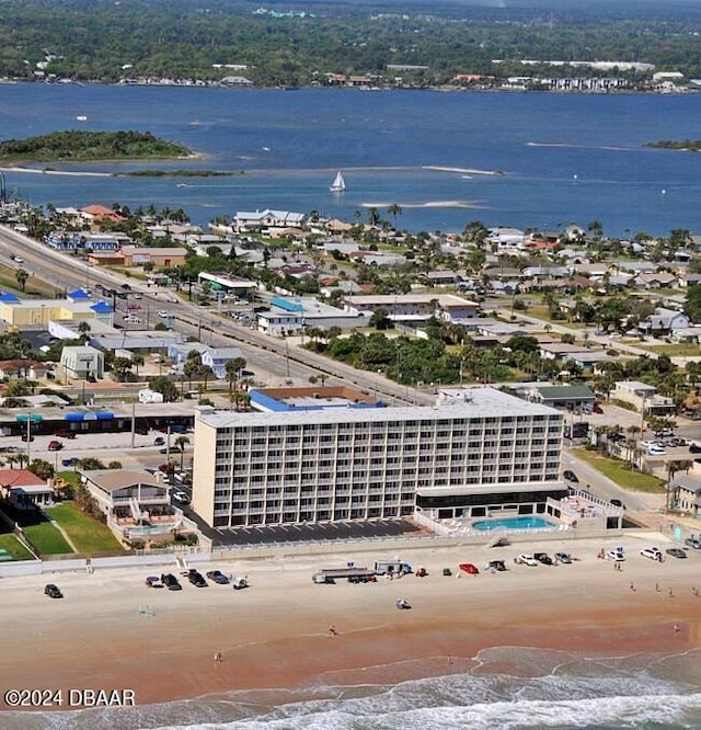 bird's eye view with a water view and a view of the beach