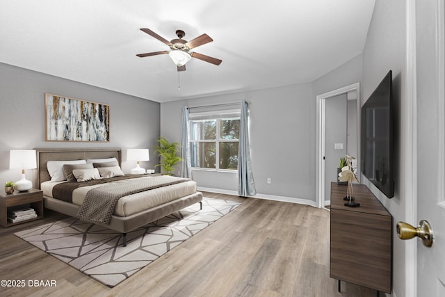 bedroom featuring ceiling fan and light wood-type flooring