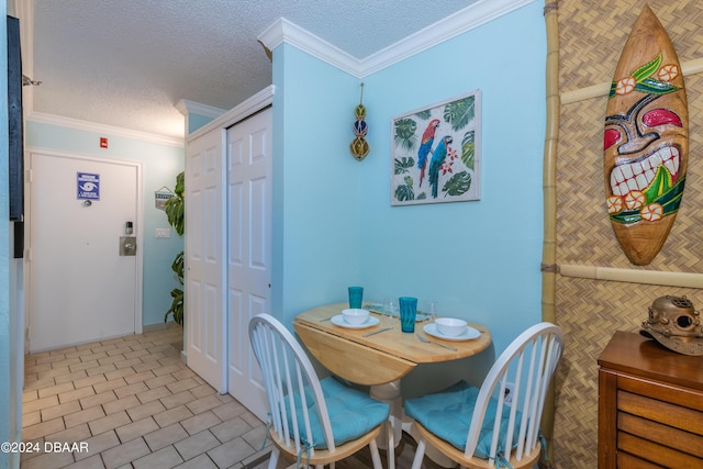 2043 S Atlantic Ave Unit 105, Daytona Beach, FL 32118 - dining room featuring a textured ceiling and ornamental molding