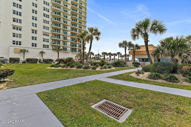 2043 S Atlantic Ave Unit 105, Daytona Beach, FL 32118 - view of community with a lawn and visible vents