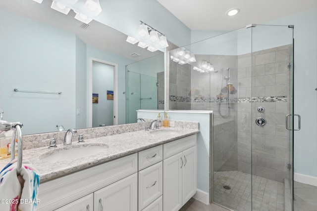 bathroom with vanity and walk in shower