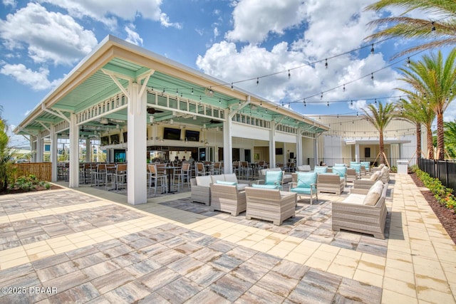 view of patio / terrace featuring exterior bar and an outdoor hangout area