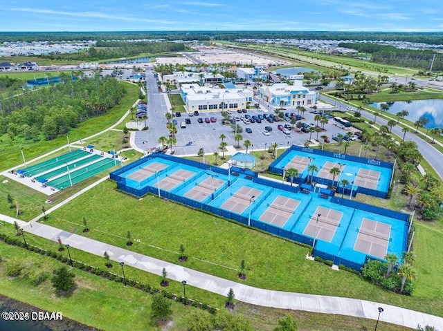 birds eye view of property with a water view