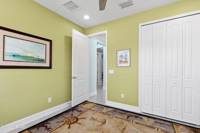 unfurnished bedroom featuring a closet and ceiling fan