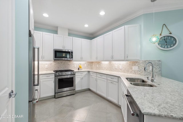 kitchen featuring white cabinetry, sink, ornamental molding, and stainless steel appliances