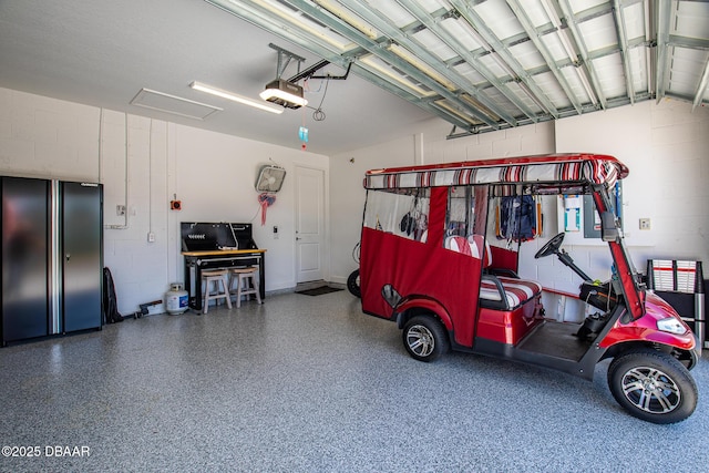 garage featuring a garage door opener