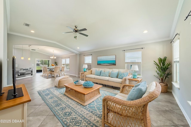 living room with visible vents, baseboards, plenty of natural light, and ceiling fan with notable chandelier