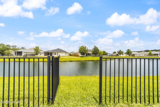 water view with fence and a residential view
