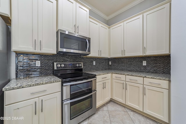 kitchen featuring crown molding, backsplash, light tile patterned flooring, and stainless steel appliances