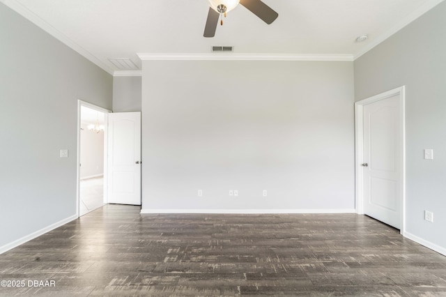 unfurnished room with ornamental molding, wood finished floors, and visible vents