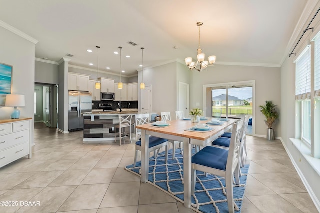 dining area with an inviting chandelier, light tile patterned flooring, visible vents, and a wealth of natural light
