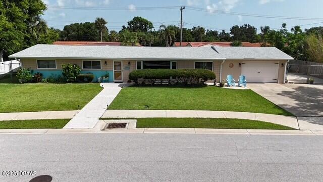39 Benjamin Dr, Ormond Beach, FL 32176 - ranch-style house with a front yard, a garage, and driveway