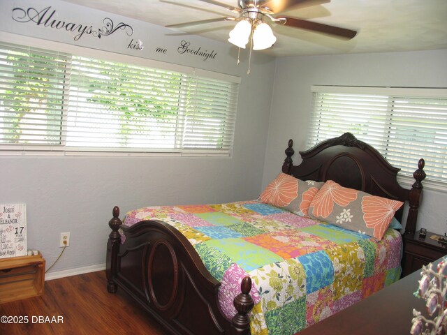 39 Benjamin Dr, Ormond Beach, FL 32176 - bedroom with wood finished floors, baseboards, and a ceiling fan