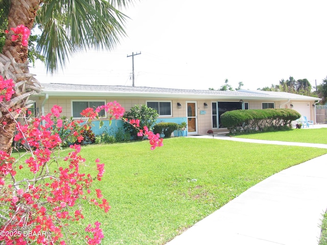 39 Benjamin Dr, Ormond Beach, FL 32176 - ranch-style house with a front yard and an attached garage