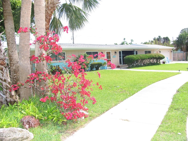 39 Benjamin Dr, Ormond Beach, FL 32176 - view of front of property featuring a front yard and a garage