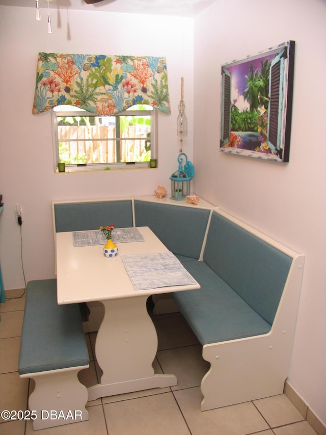 39 Benjamin Dr, Ormond Beach, FL 32176 - dining area featuring tile patterned flooring and baseboards