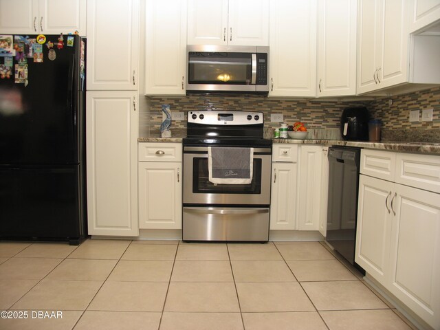 39 Benjamin Dr, Ormond Beach, FL 32176 - kitchen featuring black appliances, white cabinetry, light tile patterned flooring, and tasteful backsplash
