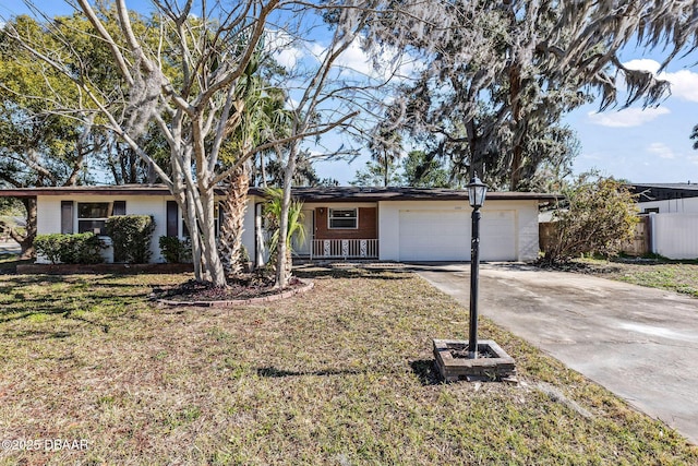 single story home featuring a garage and a front yard