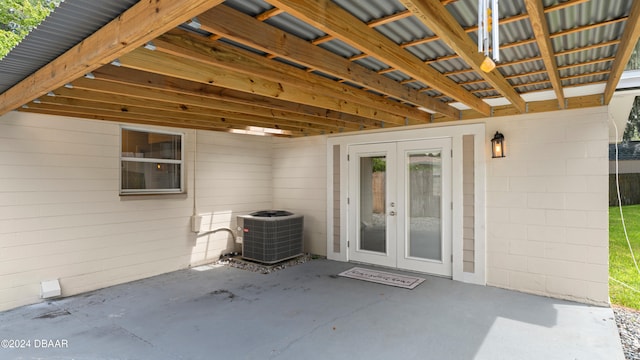 entrance to property with french doors, central AC unit, and a patio area