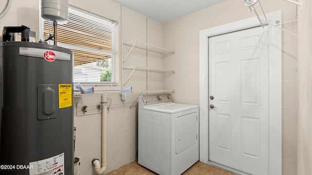 washroom with electric water heater, washer / clothes dryer, and light tile patterned floors