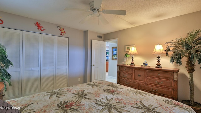 4139 S Atlantic Ave Unit A406, New Smyrna Beach, FL 32169 - bedroom with a closet, ceiling fan, and tile patterned floors