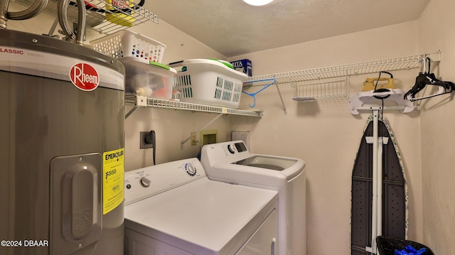 4139 S Atlantic Ave Unit A406, New Smyrna Beach, FL 32169 - washroom with water heater and separate washer and dryer