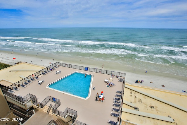 4139 S Atlantic Ave Unit A406, New Smyrna Beach, FL 32169 - drone / aerial view of expansive beach and a pool