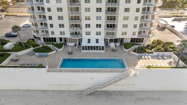 view of swimming pool with a patio