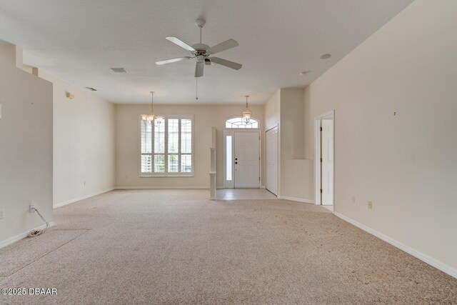 12 Sea Swallow Ter, Ormond Beach, FL 32176 - unfurnished living room with a chandelier, light colored carpet, and a ceiling fan