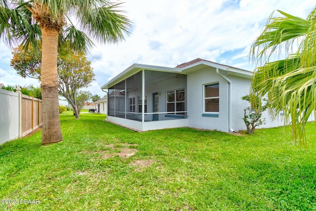 12 Sea Swallow Ter, Ormond Beach, FL 32176 - rear view of property featuring a sunroom and stucco siding
