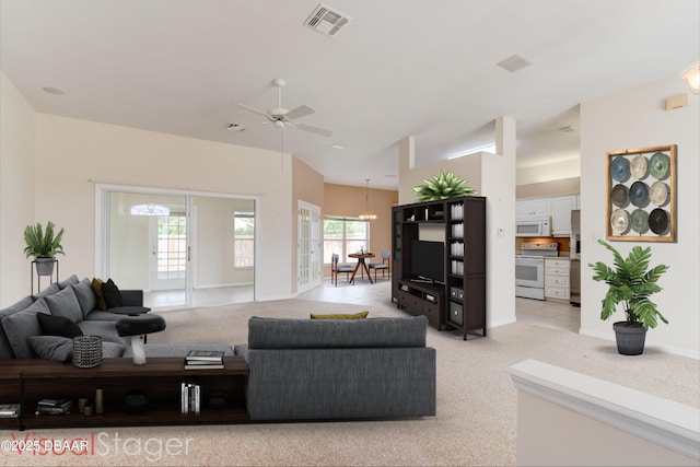 12 Sea Swallow Ter, Ormond Beach, FL 32176 - living room featuring light carpet, a chandelier, and ceiling fan