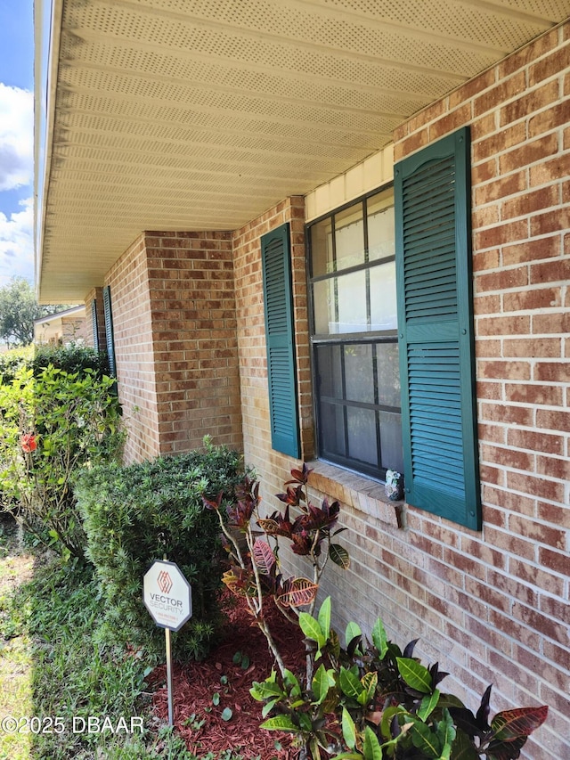 812 S Kottle Cir Unit S, Daytona Beach, FL 32114 - view of exterior entry featuring covered porch and brick siding
