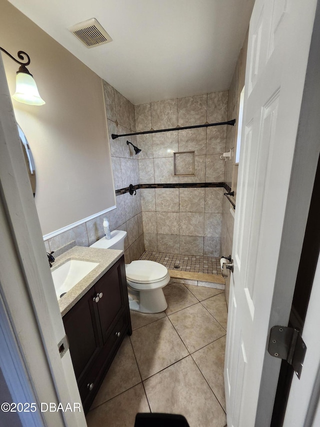 812 S Kottle Cir Unit S, Daytona Beach, FL 32114 - full bathroom with vanity, toilet, a shower stall, tile walls, and tile patterned flooring
