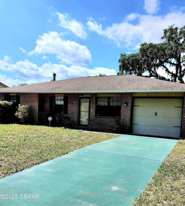 812 S Kottle Cir Unit S, Daytona Beach, FL 32114 - ranch-style house featuring brick siding, an attached garage, concrete driveway, and a front lawn