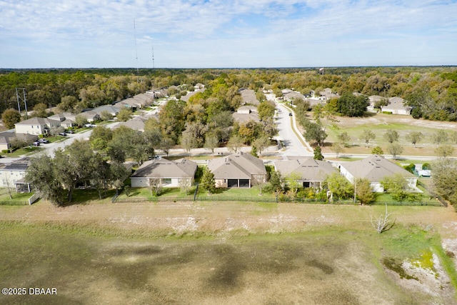 aerial view featuring a forest view and a residential view