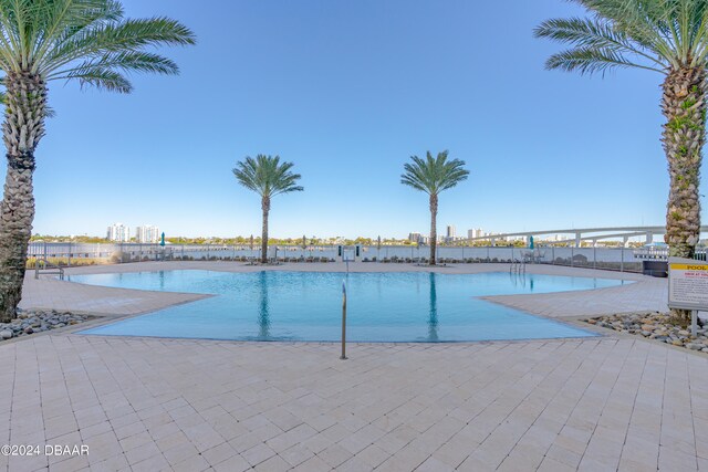 view of swimming pool with a patio area