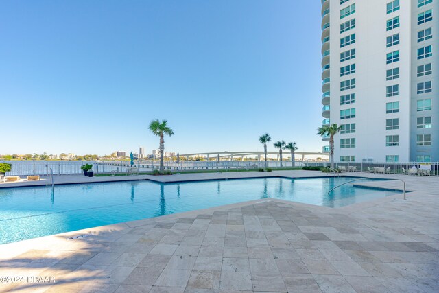 view of swimming pool featuring a patio area