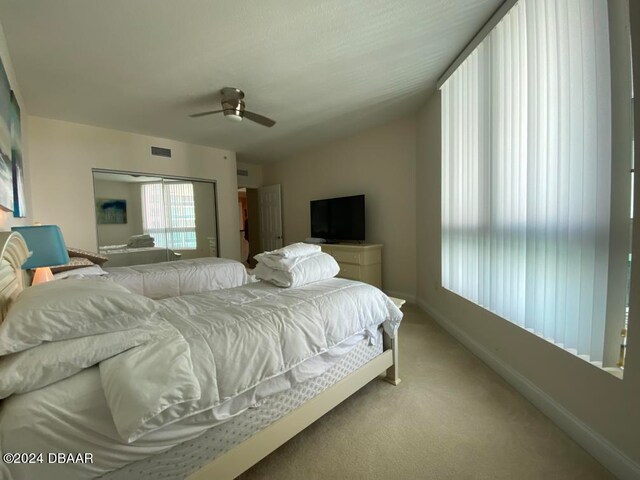 bedroom with ceiling fan and carpet floors