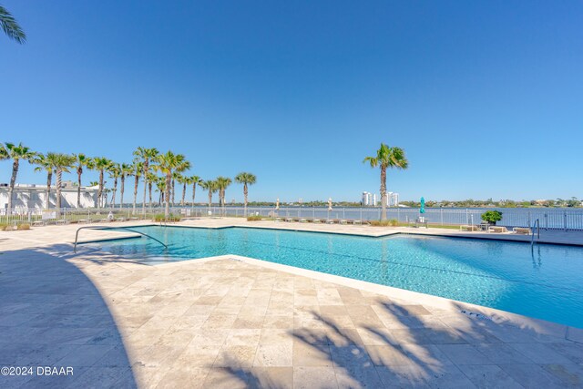 view of pool featuring a patio area