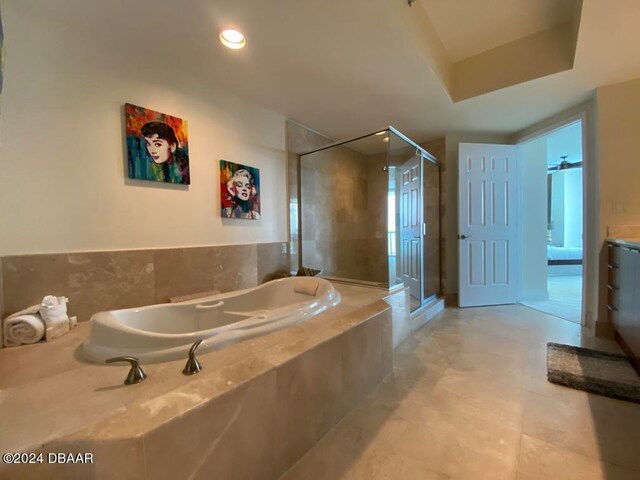 bathroom featuring vanity and shower with separate bathtub