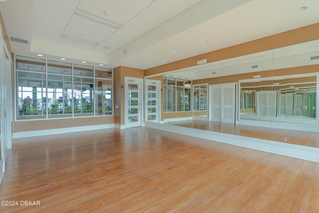 unfurnished room with hardwood / wood-style floors